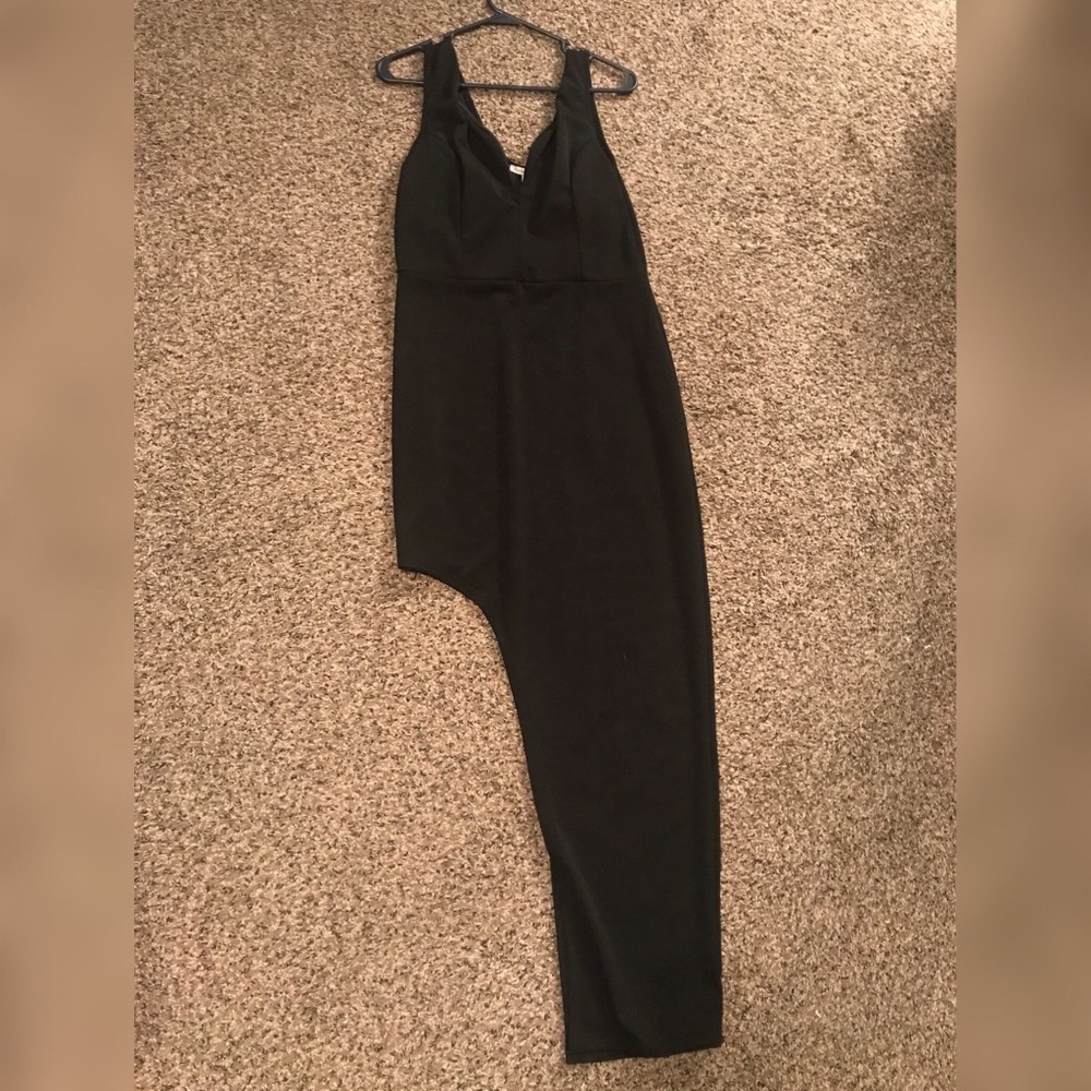 Long black formal style dress with thigh cut out.